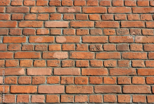 Century years old brick wall of Roman Catholic church