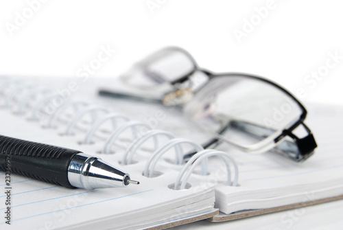 notebook & pen with glasses