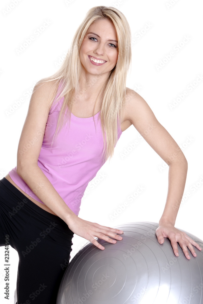 Young woman exercising on fitness ball Young woman exercising on fitness ball