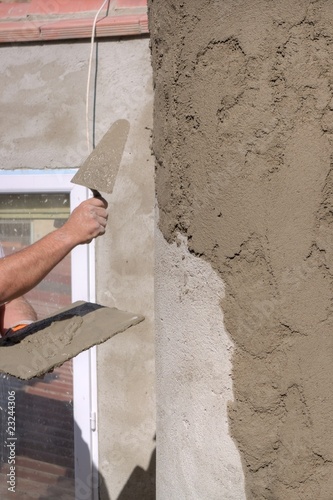 Plastering a wall outside photo