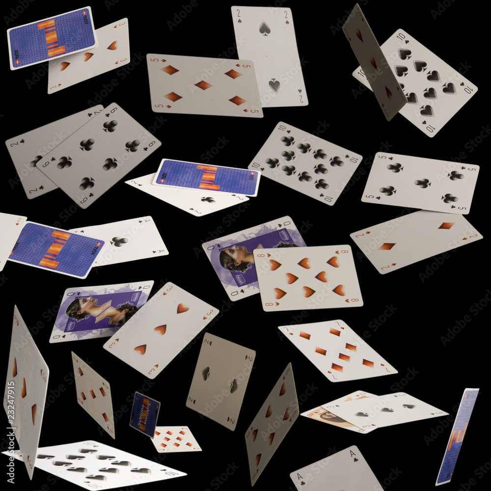 Flying cards on a black background Flying cards on a black background