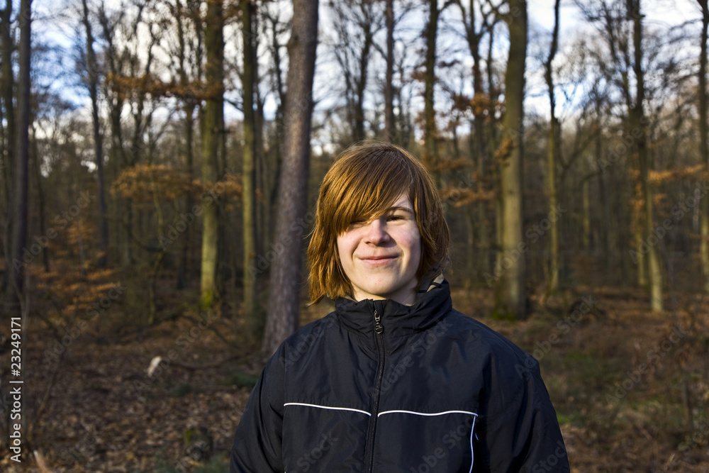 smiling boy in the forest smiling boy in the forest