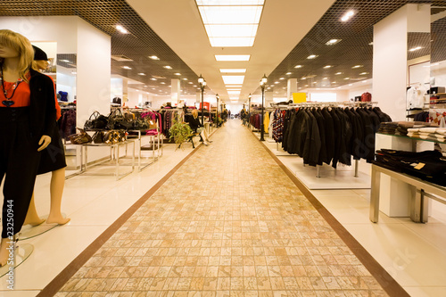 big shop of clothes, autumn clothes and collection of female bag