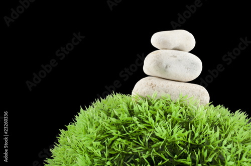 Three stones and grass ball photo