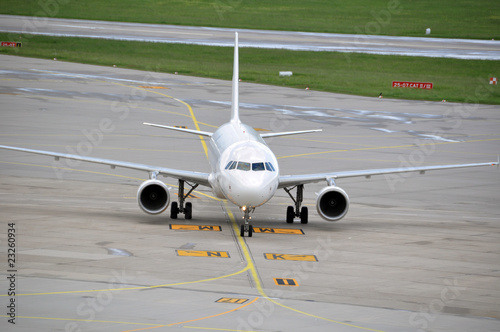 Airplane taxiing at large airport