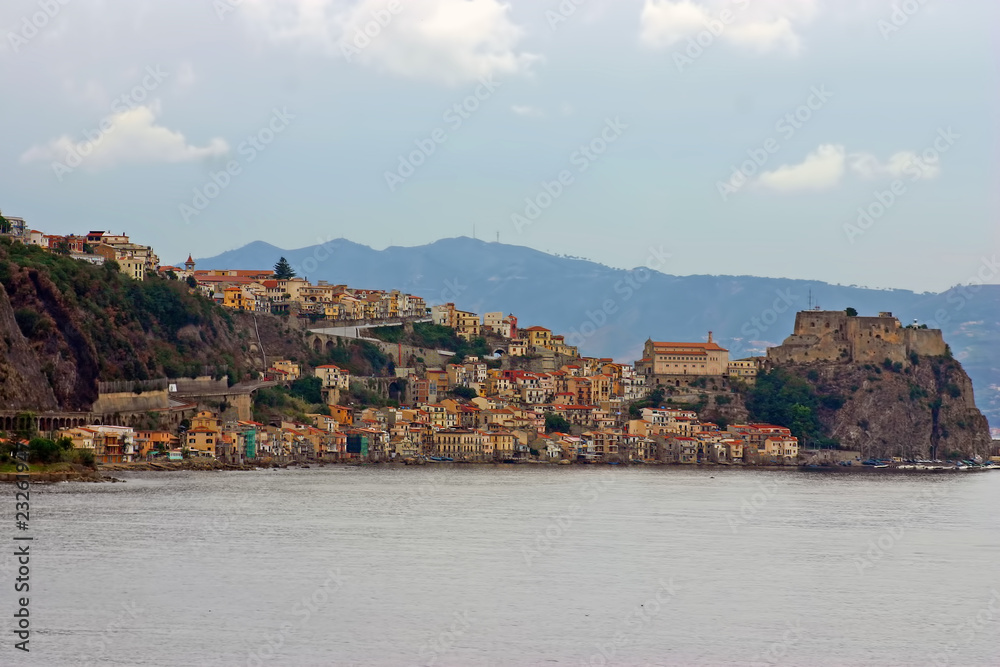 italian town Scilla clustered on a mountain ridge at the sea