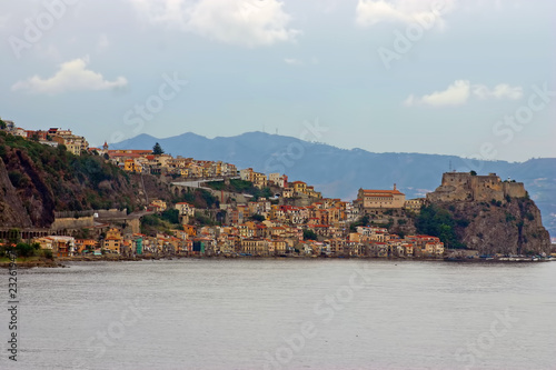 italian town Scilla clustered on a mountain ridge at the sea