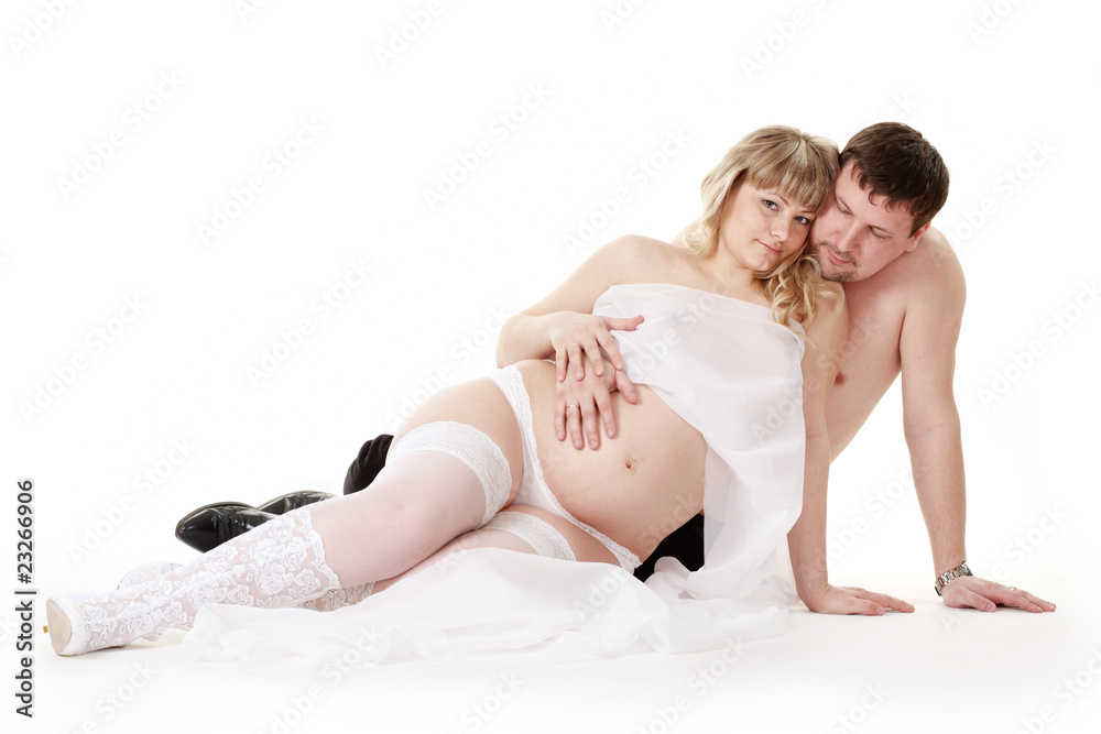 pregnant woman in underwear with her husband pregnant woman in underwear with her husband