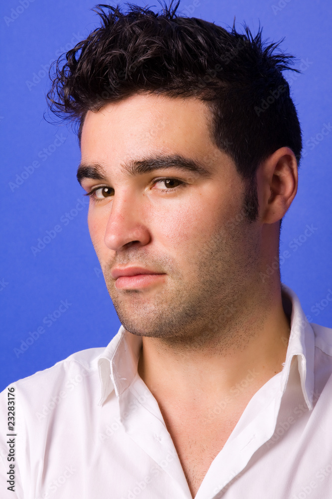 Fototapeta premium casual young man portrait over a blue background