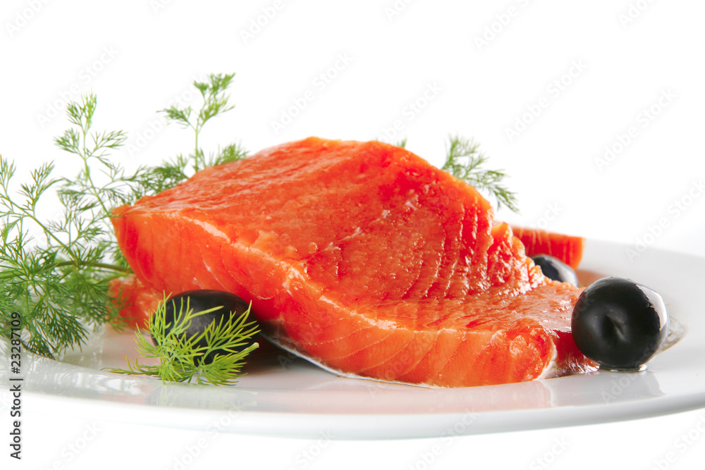 fresh smoked salmon on white plate with olives fresh smoked salmon on white plate with olives