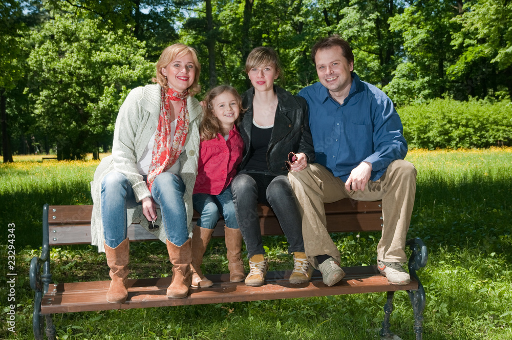 Happy family on the bench