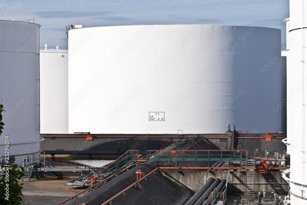 white tanks in tank farm with blue sky white tanks in tank farm with blue sky