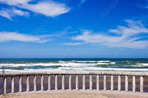 Ocean coastline landscape with railings on a foreground