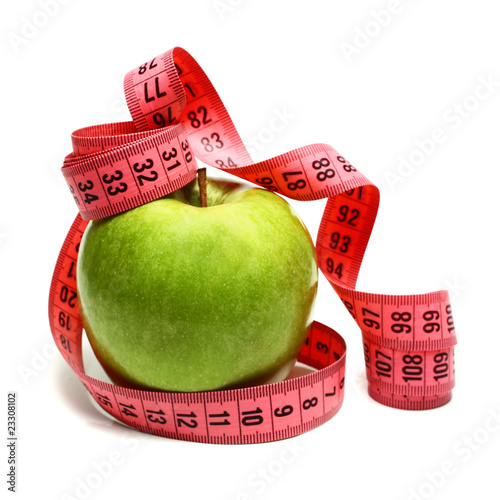 measuring ribbon and apple for diet
