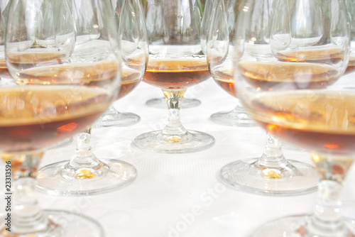 Row of drink glasses on table with selective focus