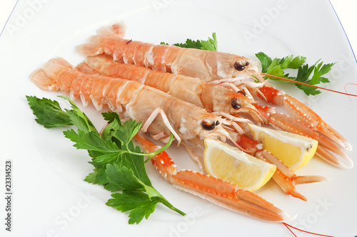 three prawns with lemon and parsley photo