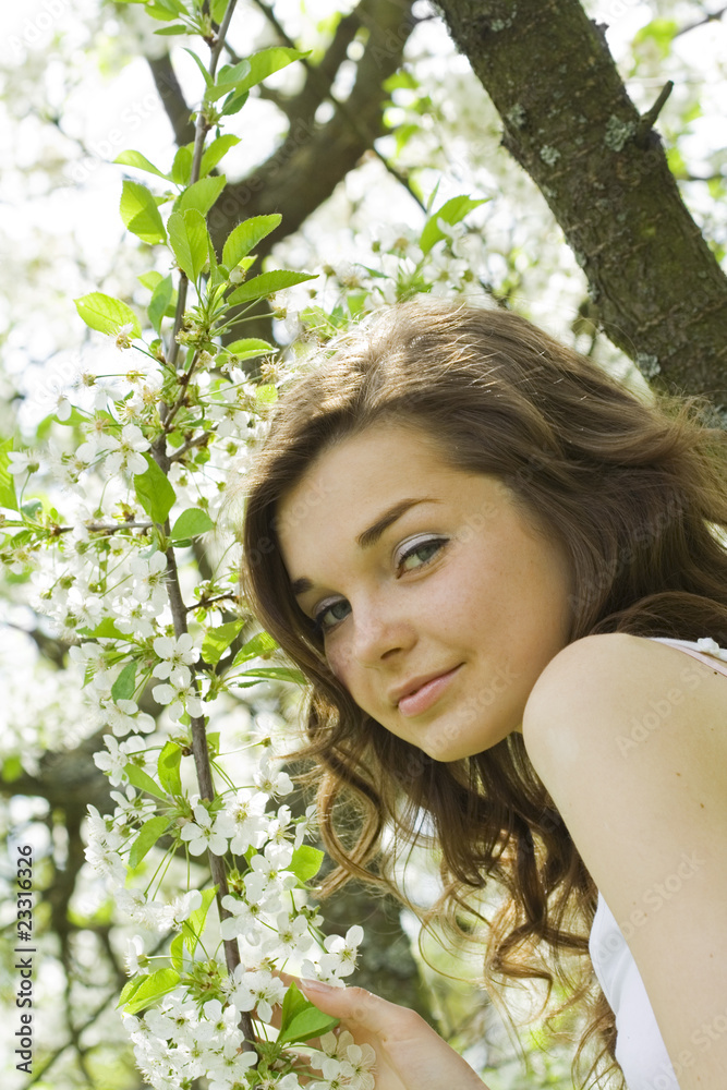 Girl under blooming tree
