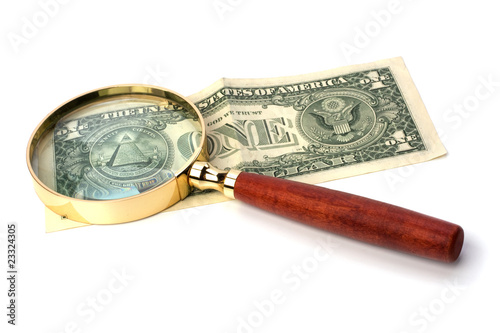 hand magnifier over banknote
