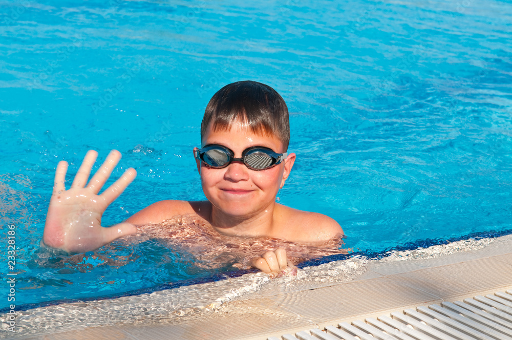 teenager swims in pool