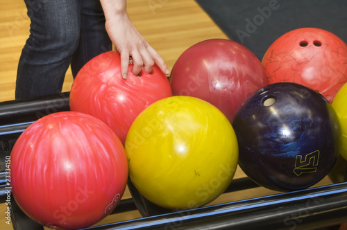 Bowling ball in player woman hand