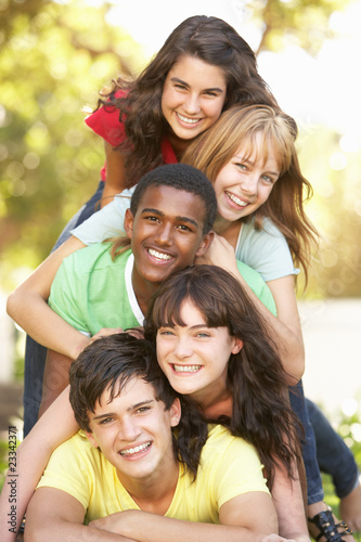 Group Of Teenagers Piled Up In Park