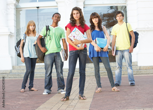 Group Of Teenage Students Standing Outside College Building