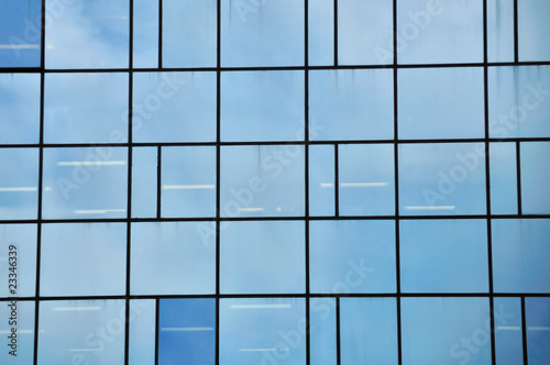 Facade of a modern glass building. Architectural detail.