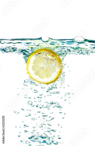 Sliced lemon splash in water