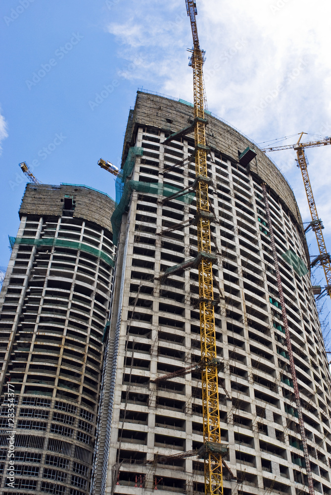 Fototapeta premium Skyscraper building on a background of the blue sky