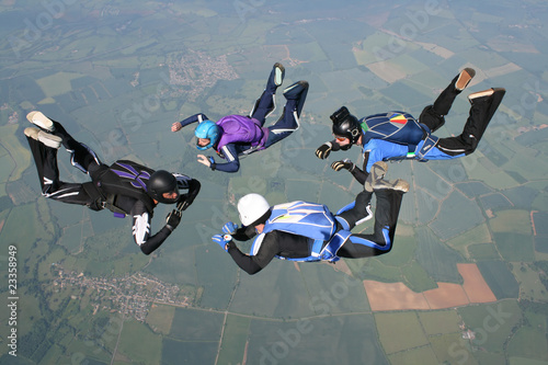 Four skydivers in freefall