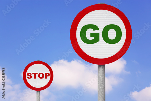 Round roadsigns with GO and STOP on photo