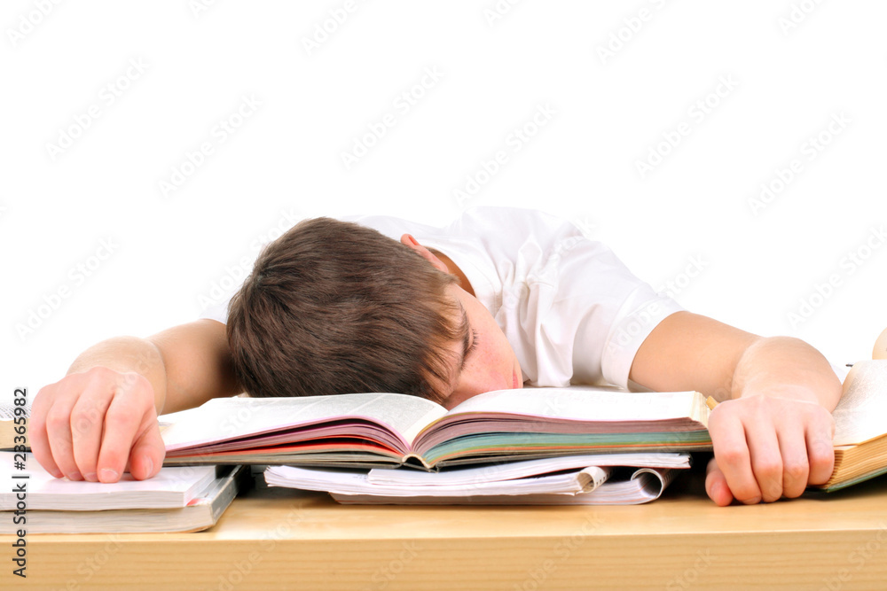 tired teenager lying and sleeping on the books tired teenager lying and sleeping on the books