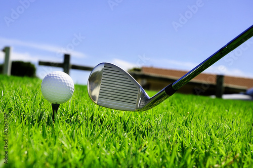 ball and golf clubs photo