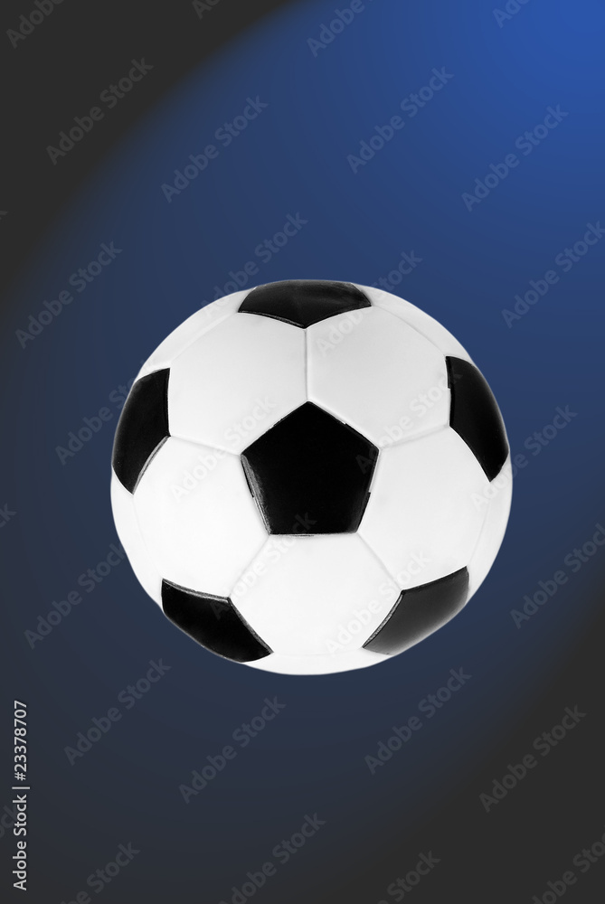 black and white soccer ball isolated on the  blue and grey gradi