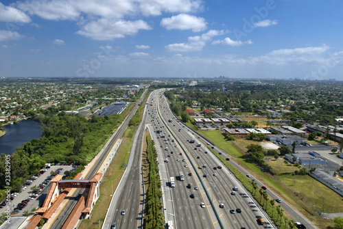 Arial view of  Interstate highway with train station and railroad tracks along the way in Hollywood Florida 