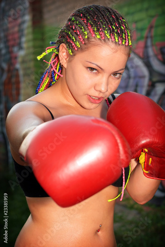 Portrait of a girl with red boxing gloves