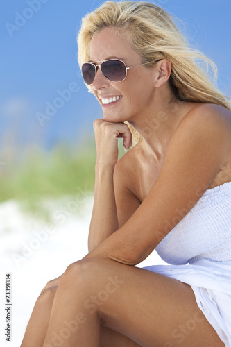 Beautiful Blond Woman in White Dress and Sunglasses At Beach © Darren Baker
