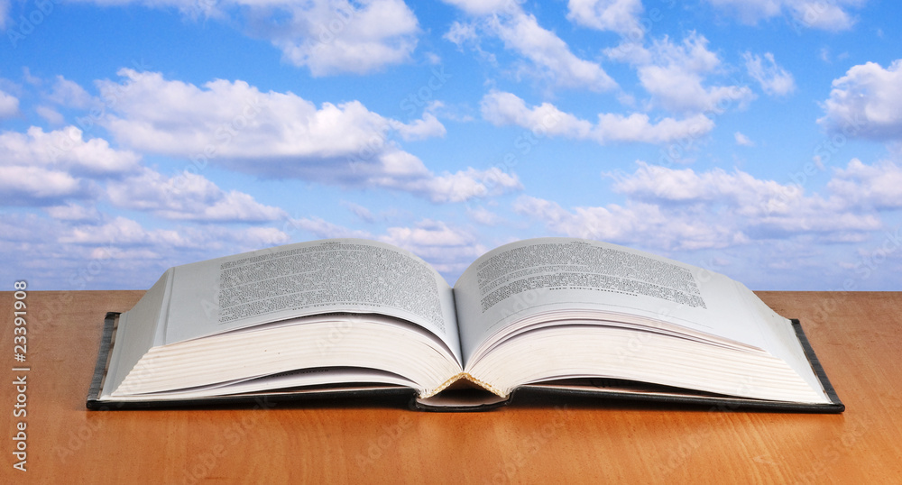 Open book on desk Open book on desk