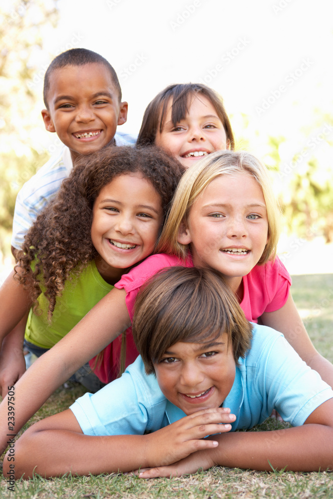 Group Of Children Piled Up In Park