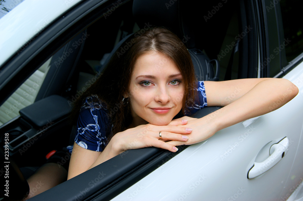 Pretty woman looking in the car window