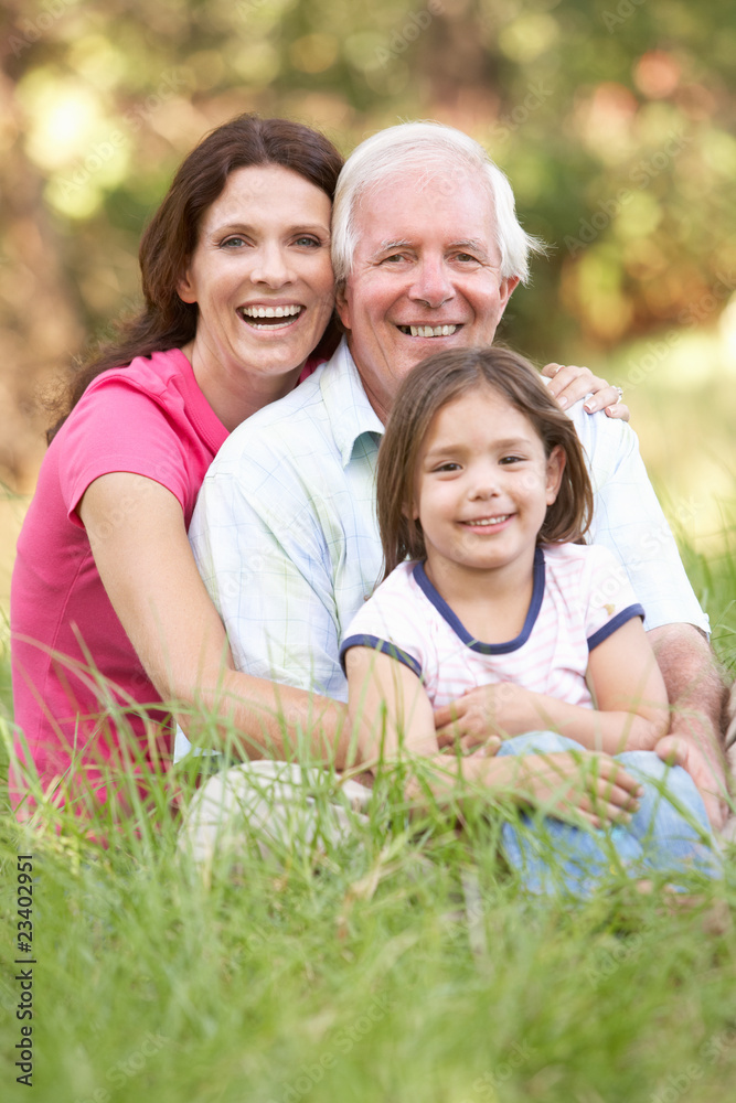 Grandfather With Daughter And Granddaughter In Park