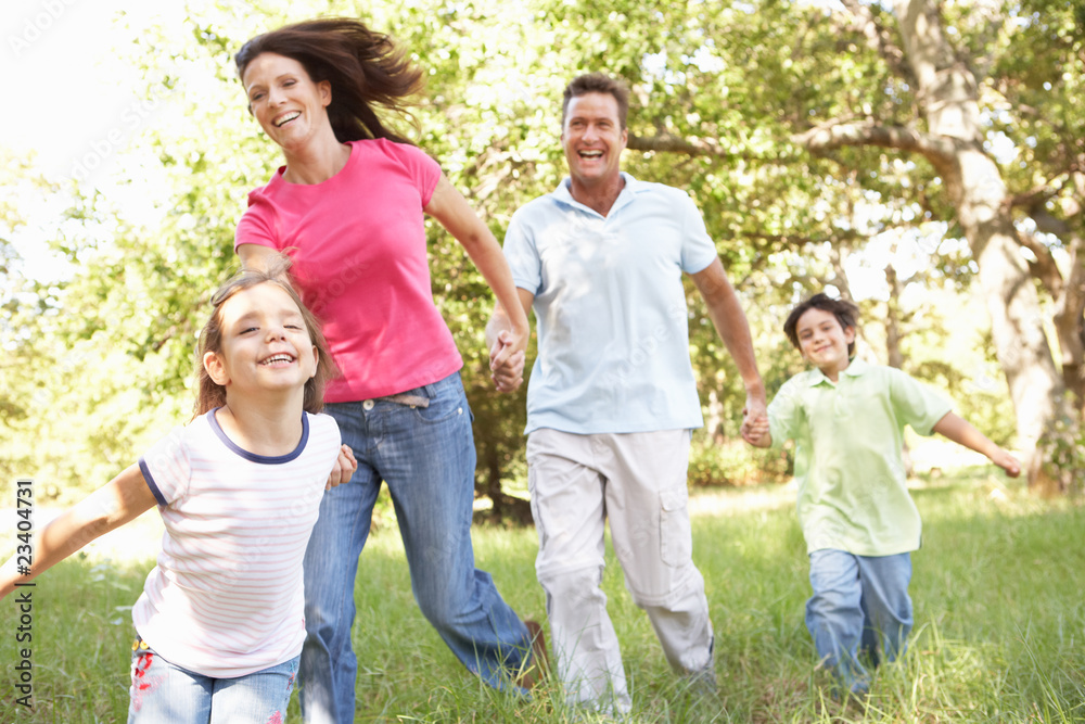 Fototapeta premium Family Enjoying Walk In Park