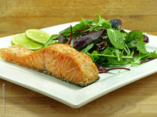 fried salmon fillet with baby greens salad