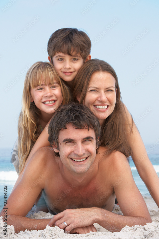Young Family Having Fun On Beach Holiday Young Family Having Fun On Beach Holiday