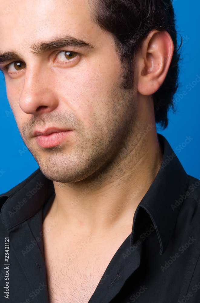 Obraz premium Young casual atractive man portrait, on a blue background