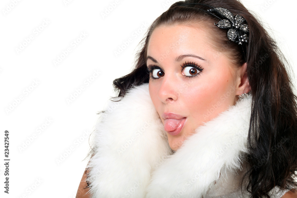 beautiful brunette in white fur showing tongue on white