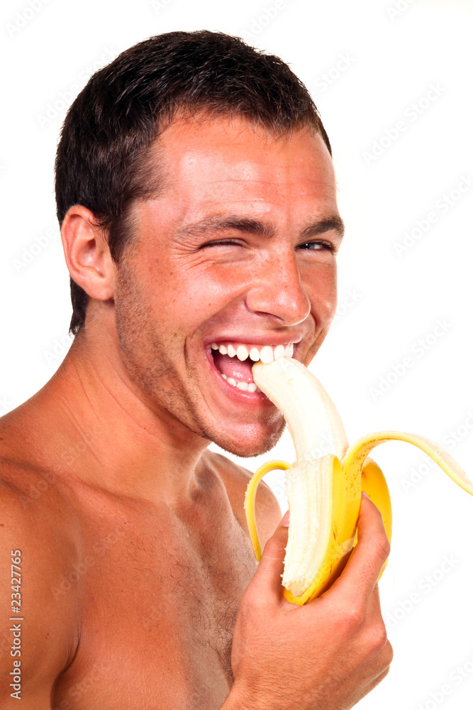 Young sexy handsome man eating banana Stock Photo Adobe Stock