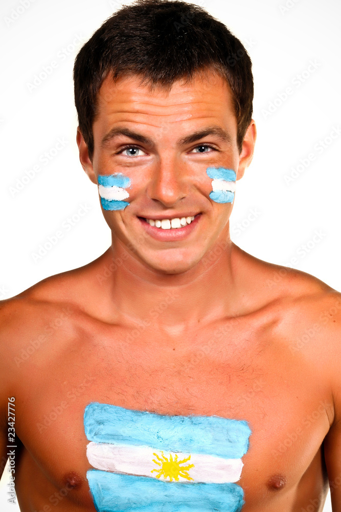 Portrait of an argentinian fan with flag on his body and face