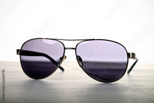 Mirrored aviator sunglasses on the table