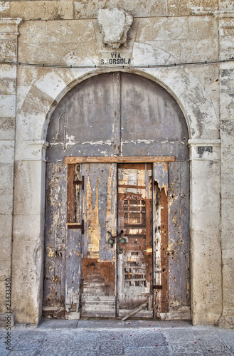 Wooden crumbling door.